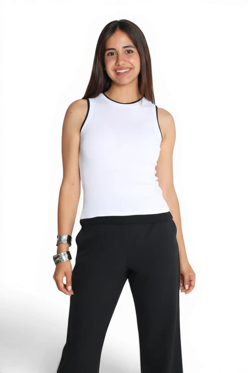 Model wearing a Meraki Closet PS white sleeveless contour top with black trim, paired with black trousers.
